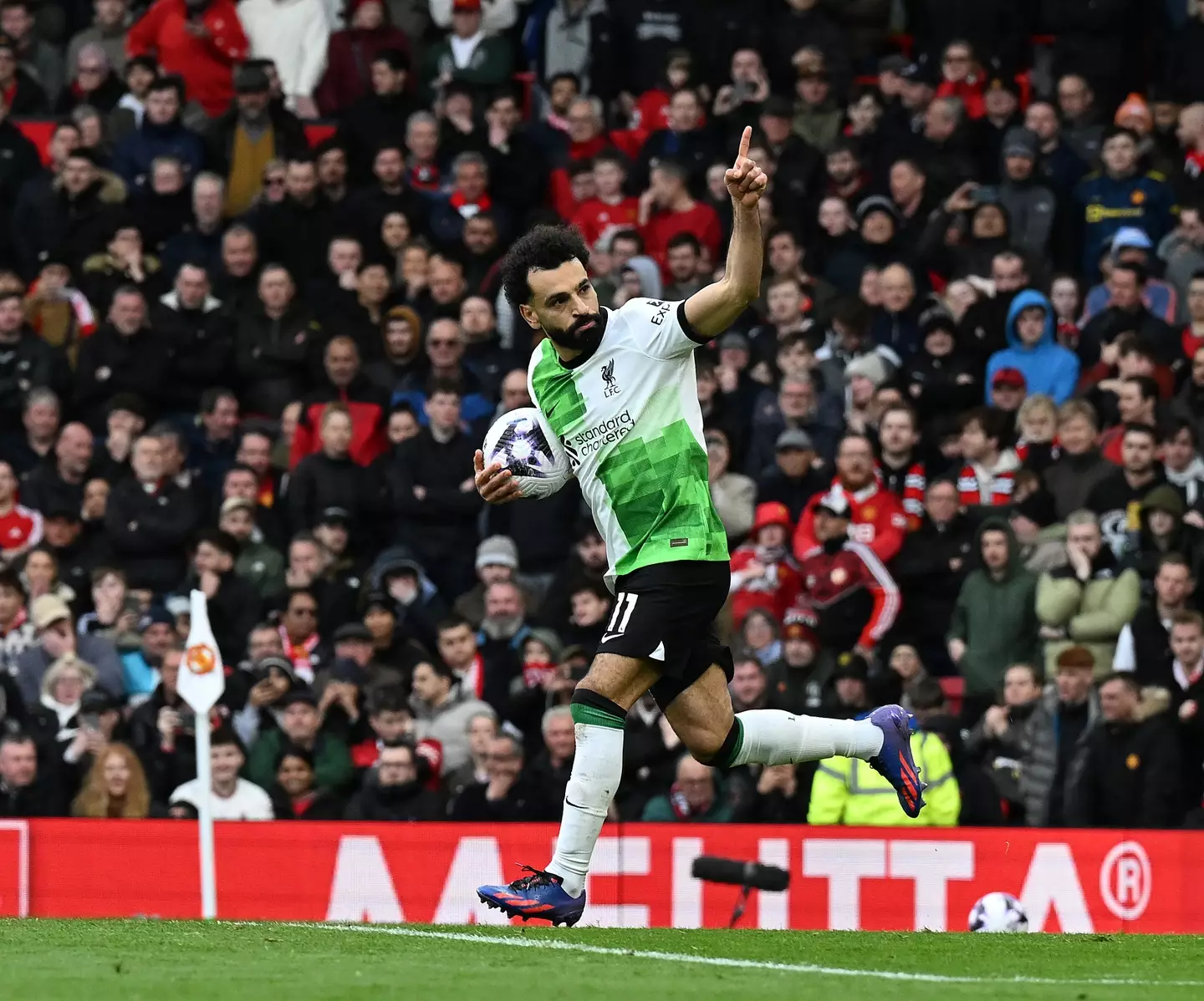 Mohamed Salah wheels away in celebration after scoring against Manchester United. Image: Getty