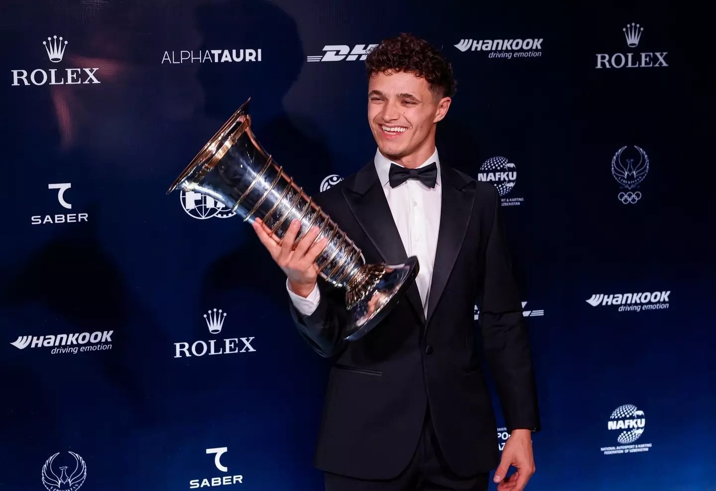 Lando Norris with the drivers' championship trophy. Image: Getty
