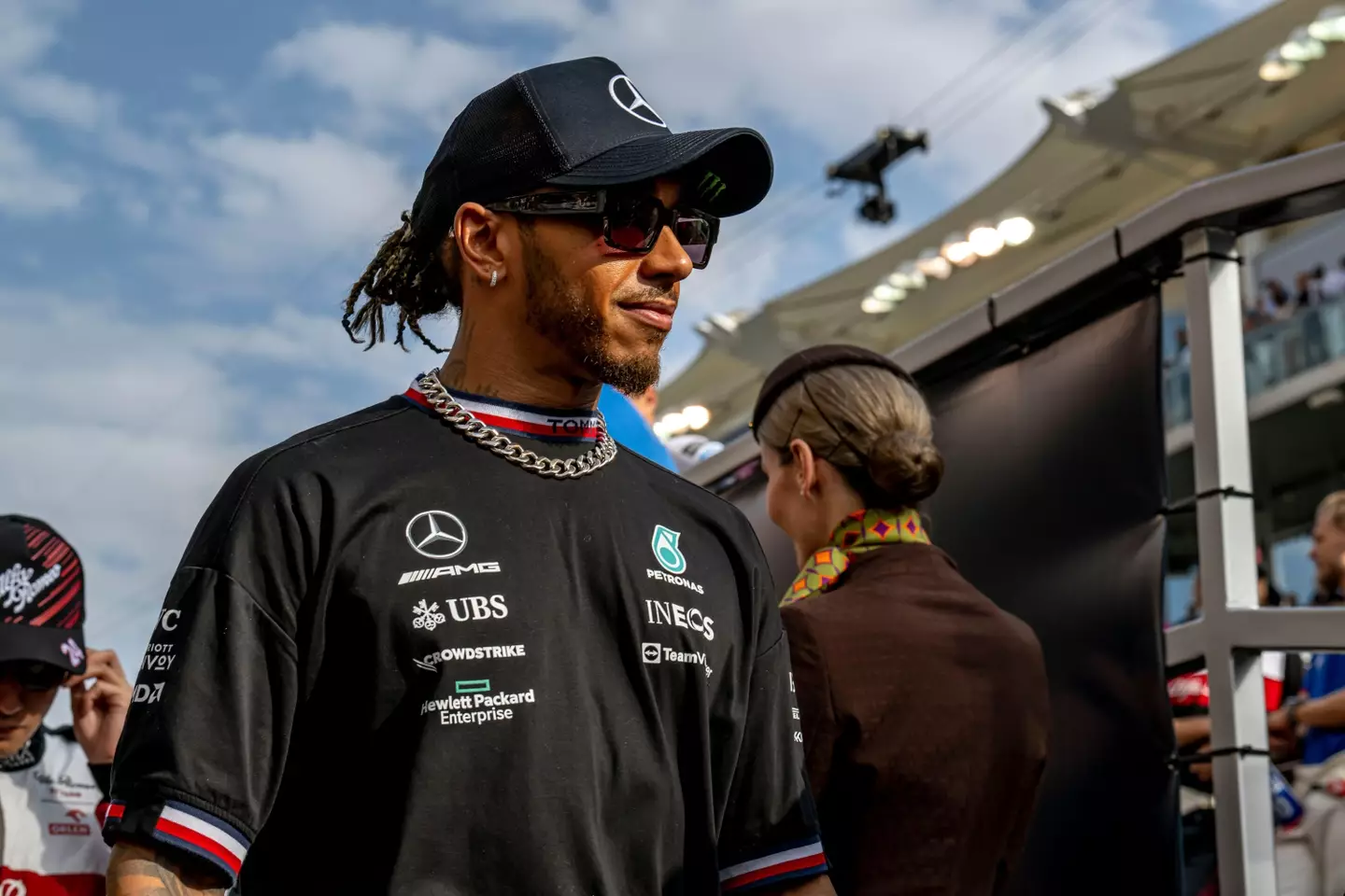 Sir Lewis Hamilton can often be seeing whizzing around on a scooter before a race. Image: Alamy