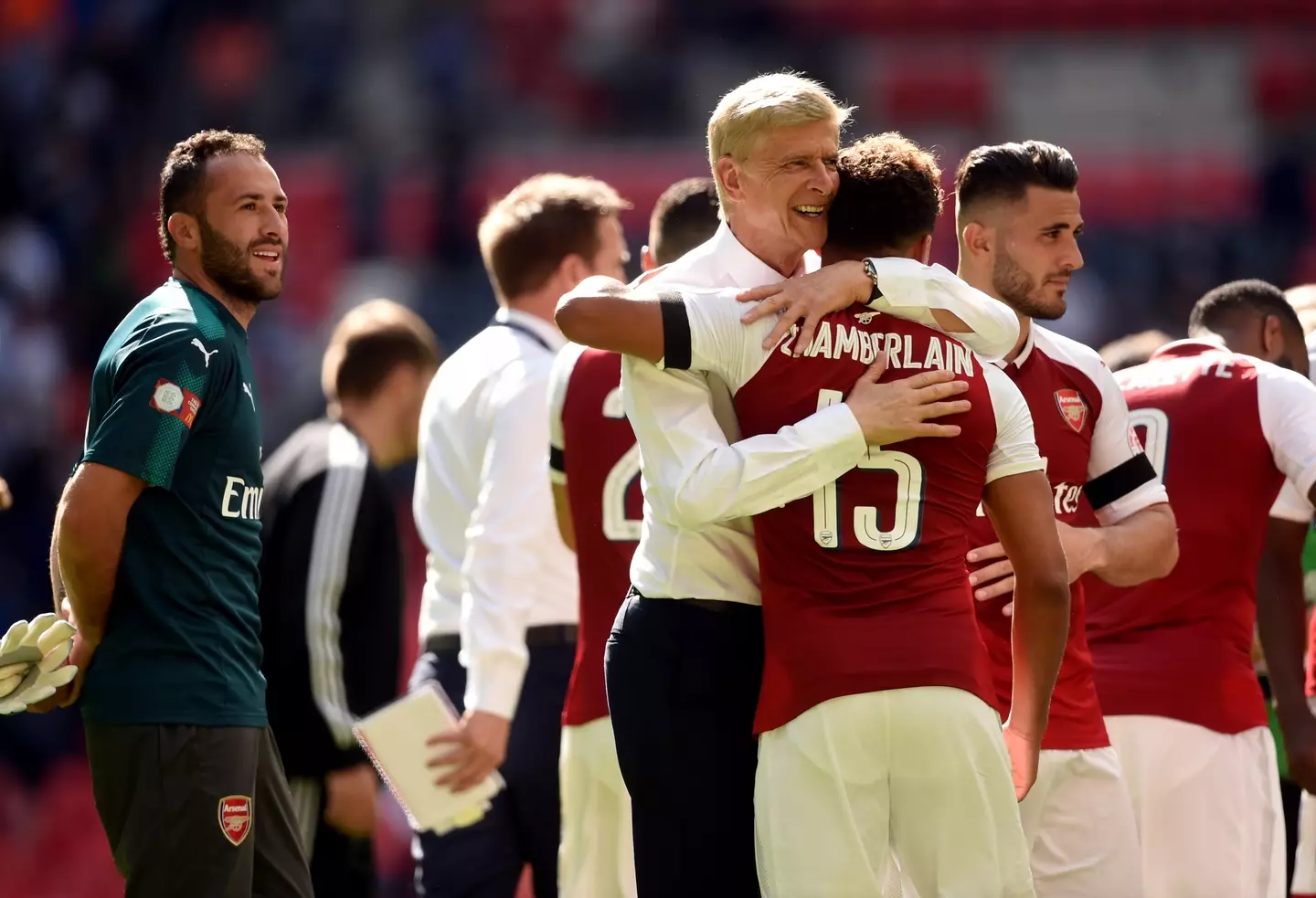 Wenger embraces Oxlade-Chamberlain after FA Cup win. 