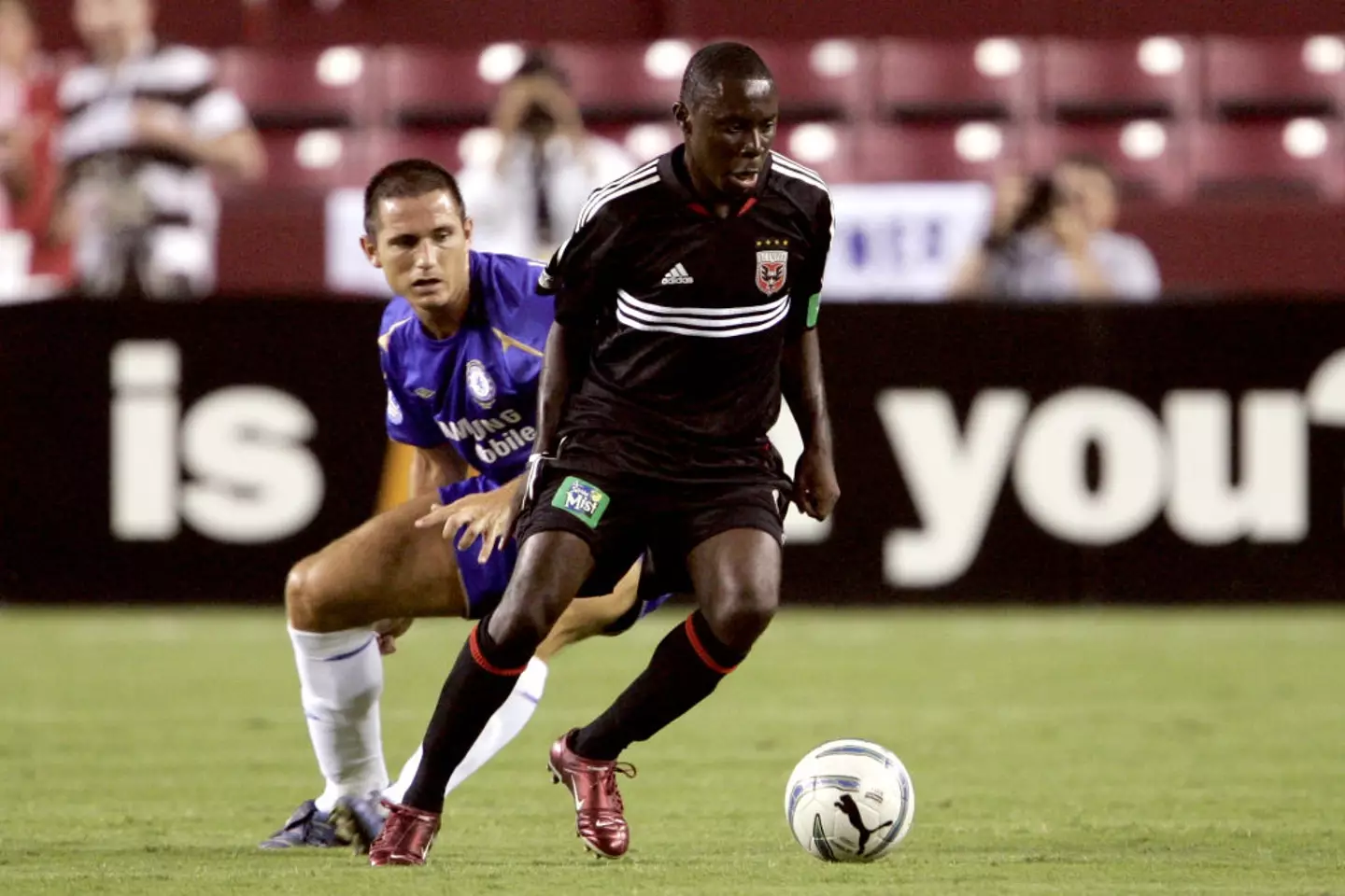 Freddy Adu faces off against Frank Lampard during a pre-season friendly against Chelsea - Getty