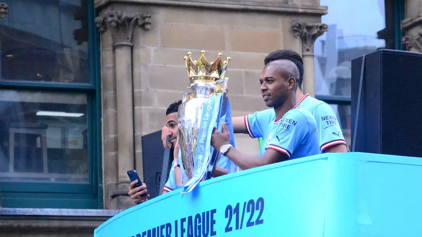 Fernandinho celebrates Manchester City's Premier League title of 2021/22.