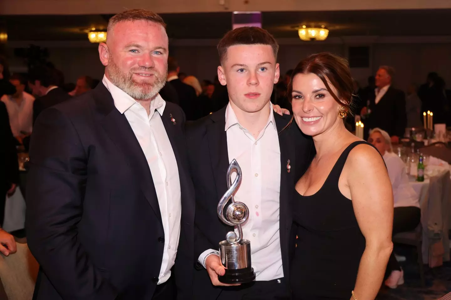 Wayne, Kai and Coleen Rooney pictured at an awards ceremony (Image: Getty)