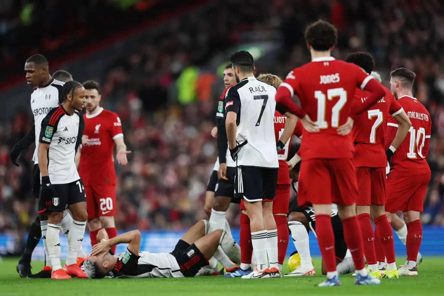 Andreas Pereira lies on the floor after clashing with Virgil van Dijk. Image: Getty