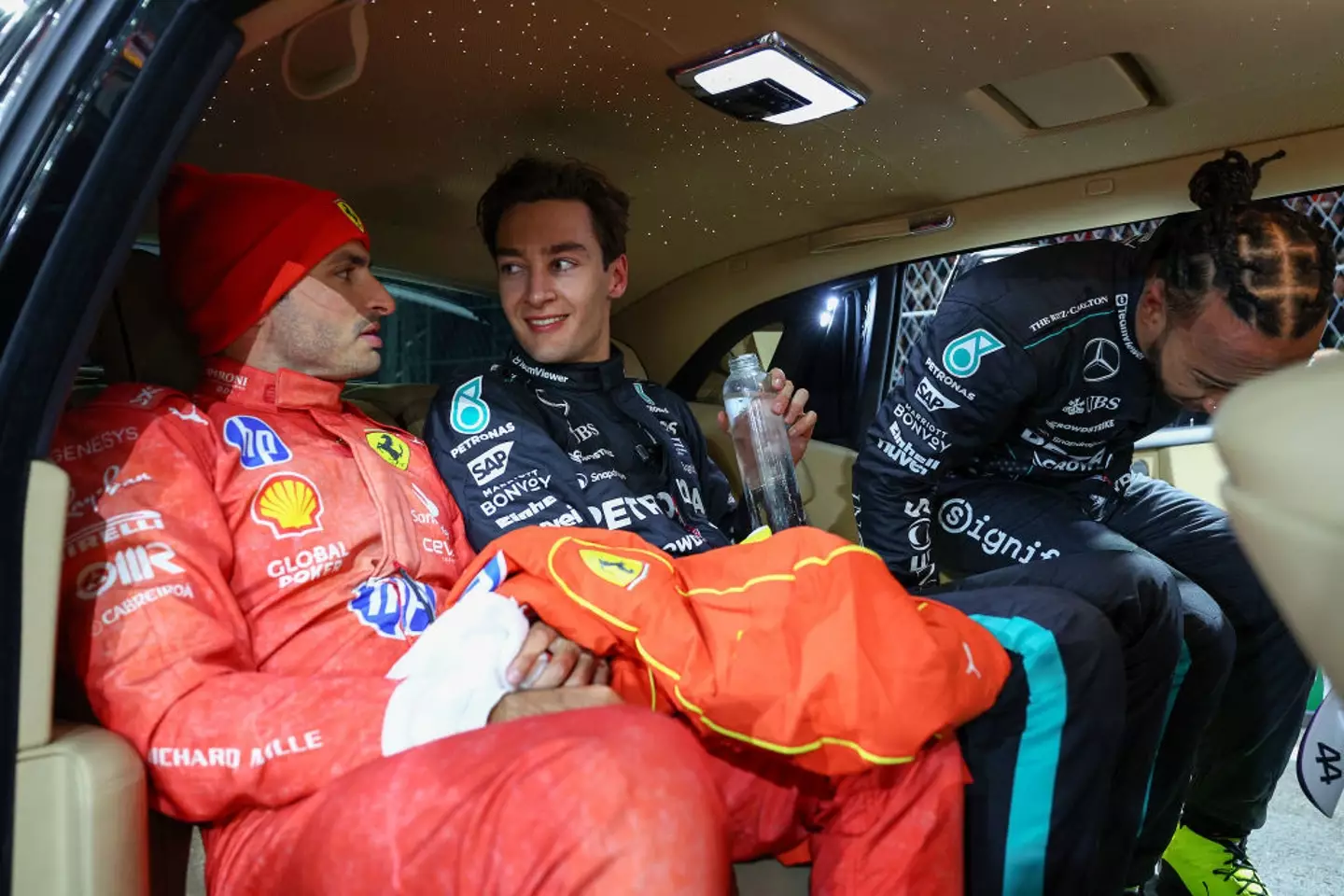 From left - Carlos Sainz, George Russell and Lewis Hamilton pictured after the Las Vegas GP (Image: Getty)