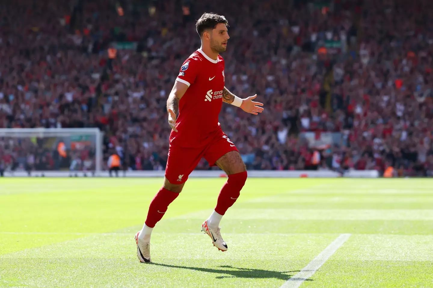 Dominik Szoboszlai wheels away in celebration. Image: Getty