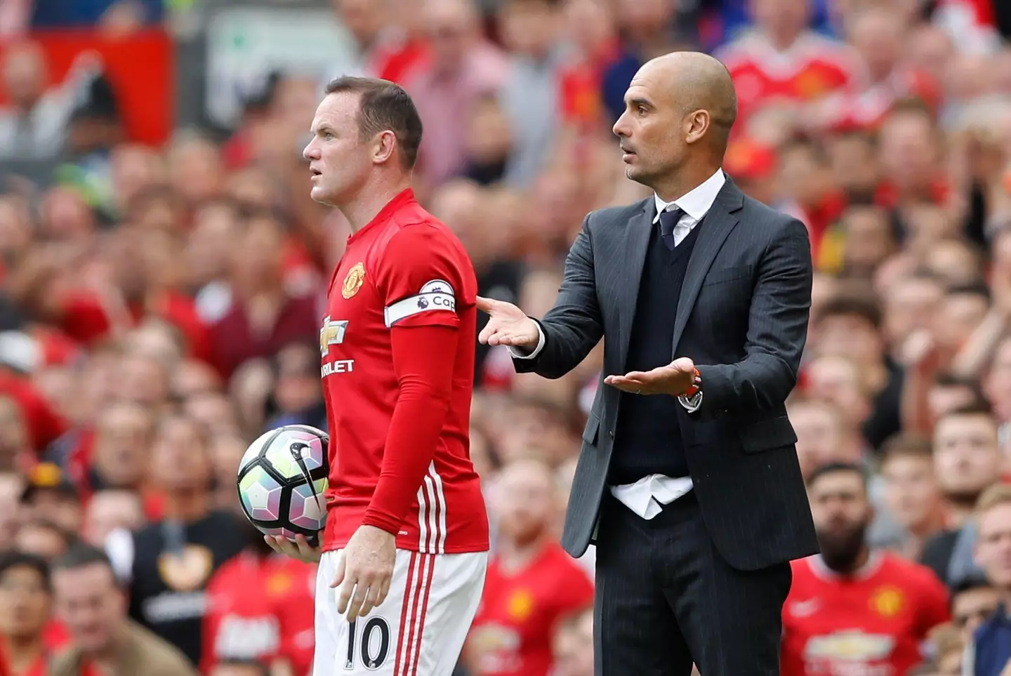 Rooney and Guardiola during the game. (Image
