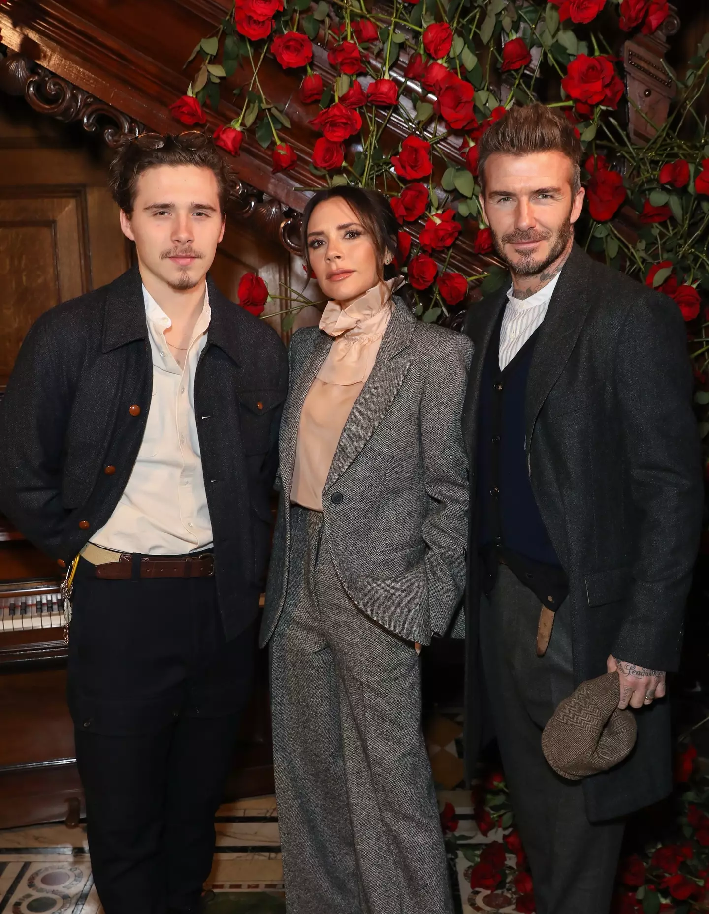 Brooklyn Beckham with parents Victoria and David (Credit:Getty)
