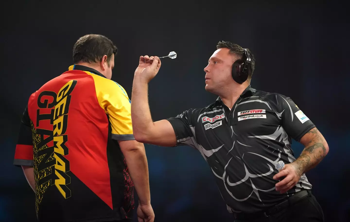 Gerwyn Price sports headphones during his match against Gabriel Clemens. Image: Alamy