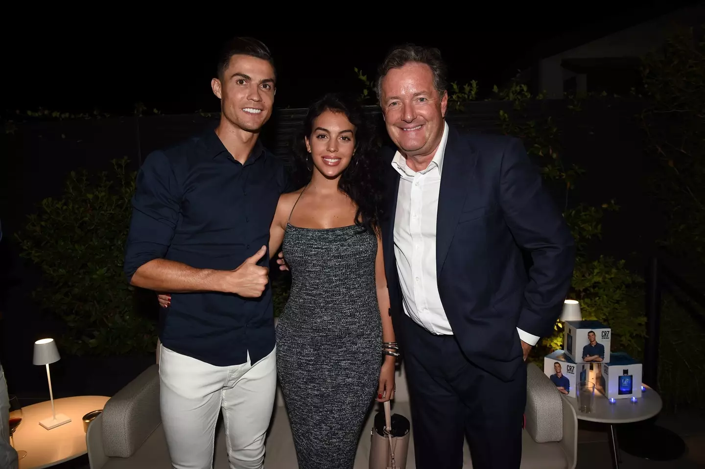 Cristiano Ronaldo, Georgina Rodriguez and Piers Morgan celebrate the launch of new CR7 Play It Cool. Image credit: Getty