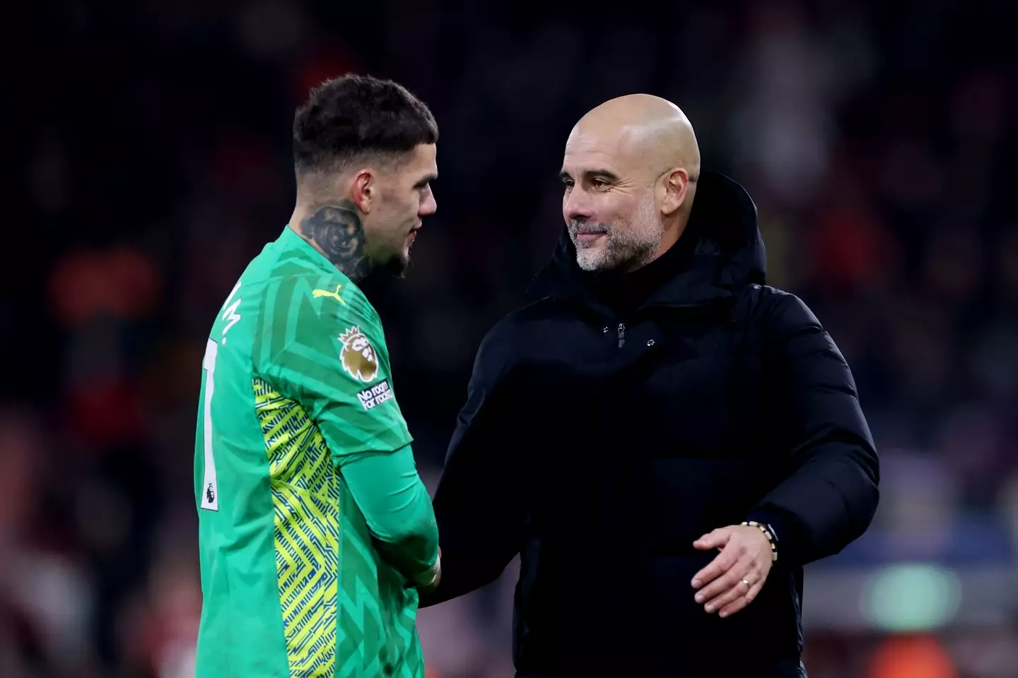 Manchester City goalkeeper Ederson and Pep Guardiola. (