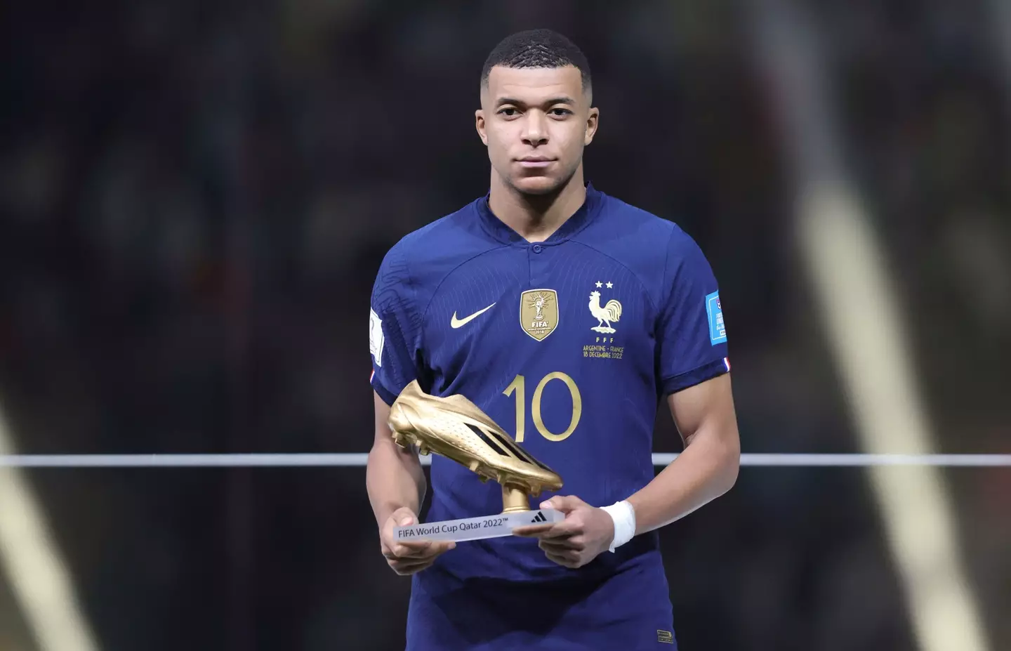 Kylian Mbappe presented with the Golden Boot award at the 2022 World Cup. Image: Alamy 