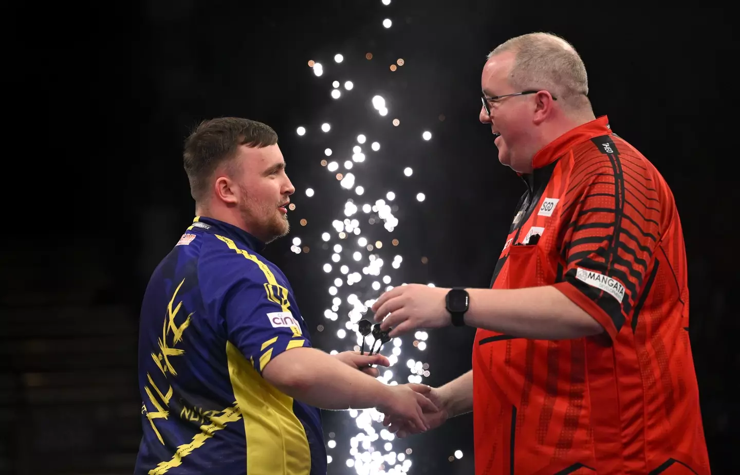 Luke Littler and Stephen Bunting share a warm embrace. Image: Getty