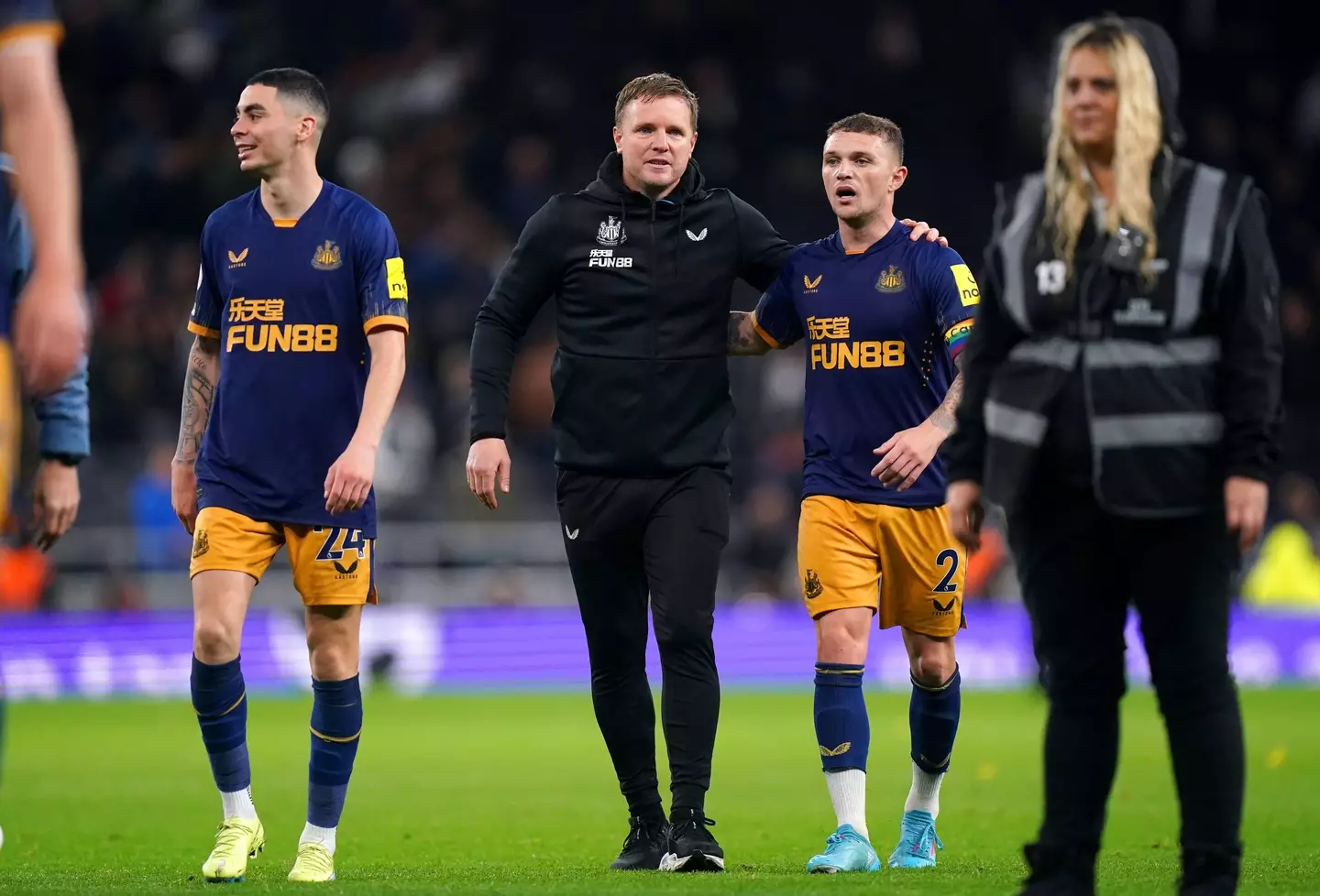 Newcastle United manager Eddie Howe (centre) hugs Kieran Trippier at the end of the Premier League match. (Alamy)