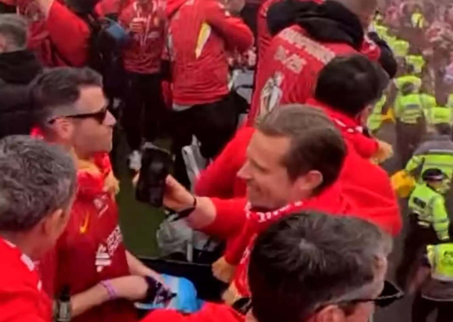 Michael Edwards was seen showing his phone to staff on the bus. Image: @SamMcGuire90