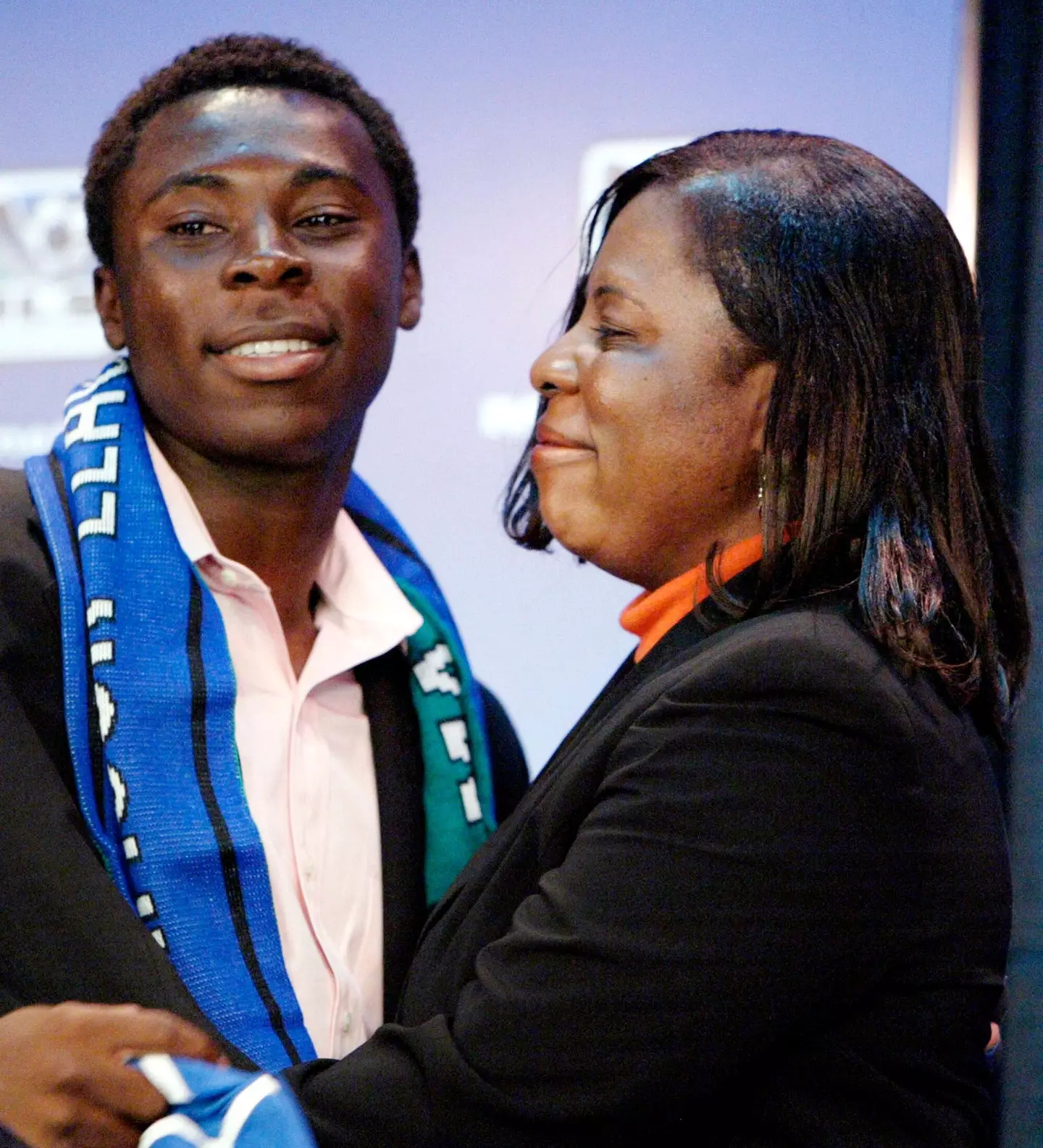 Freddy embraces his mother Emelia at a press conference in New York on November 19, 2003 where it was announced that he had signed a multi-year deal with Major League Soccer. Image credit: Alamy