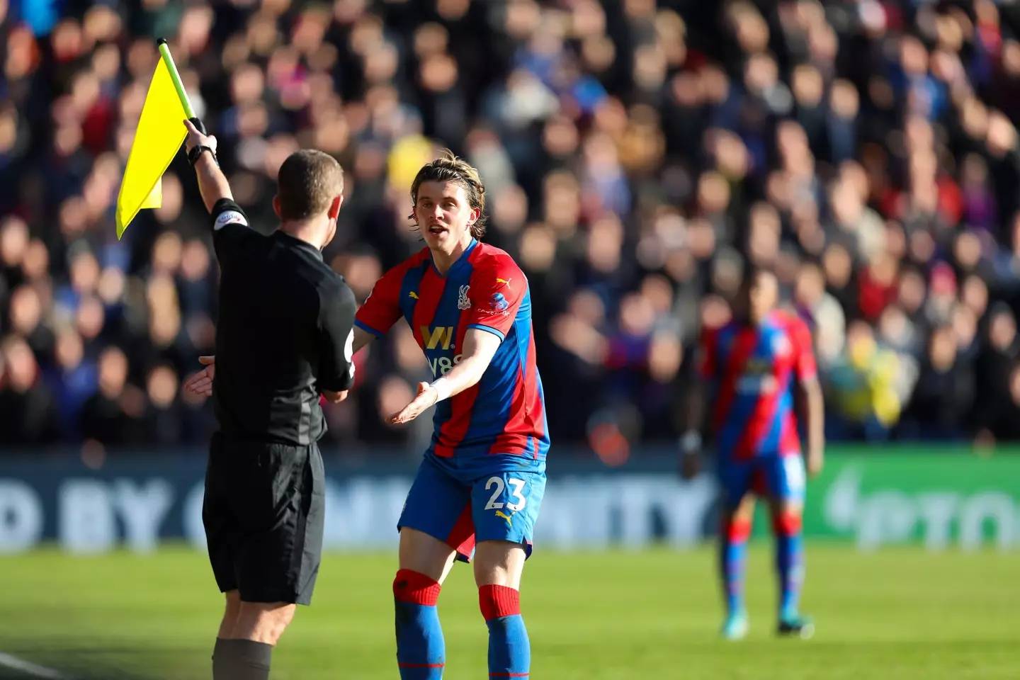 Marc Perry with his flag up much to the dissatisfaction of Connor Gallagher (Alamy)