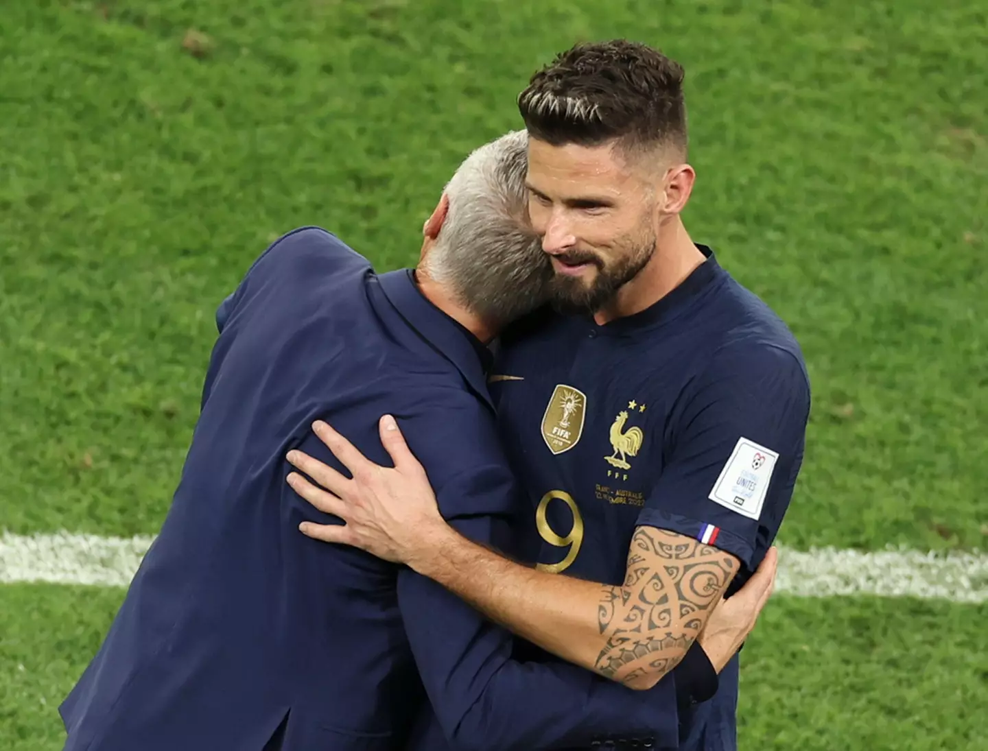 Didier Deschamps embraces Giroud after his brace against Australia. Image credit: Alamy