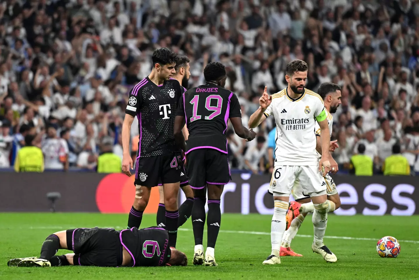 Joshua Kimmich hits the deck after being fouled by Nacho. Image: Getty
