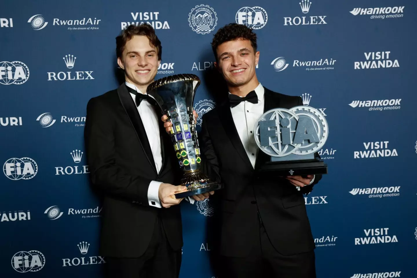 Lando Norris and Oscar Piastri pose with the 2024 Constructors' Championship (Image: Getty)