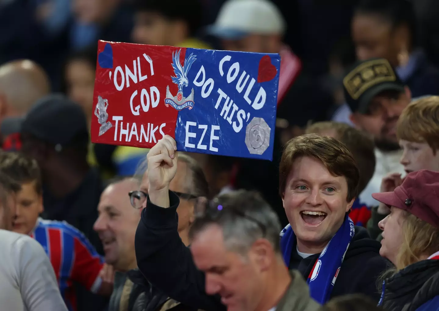 Crystal Palace fan holds aloft sign during the Conference League Play-off against Fredrikstad. Image credit: Getty