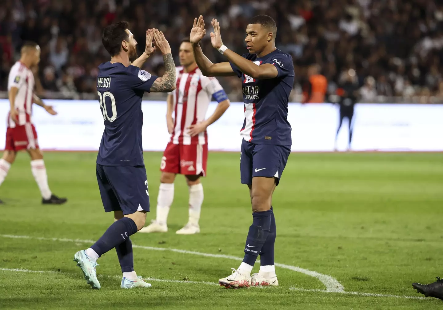 Kylian Mbappe celebrates with Lionel Messi after scoring for PSG. Image: Alamy