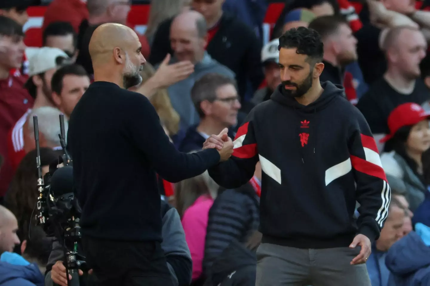 Pep Guardiola and Ruben Amorim embrace after Manchester United vs. Manchester City. Image: Getty