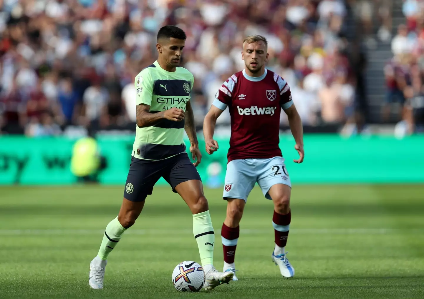Joao Cancelo moves forward with the ball for Manchester City against West Ham. (PA Images / Alamy)