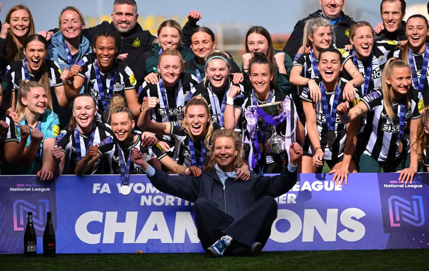 Amanda Staveley celebrates with Newcastle's women's team after their promotion to the Championship -