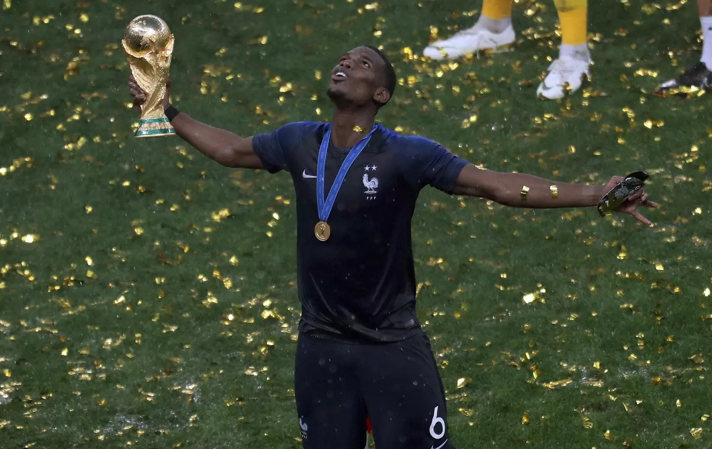Paul Pogba with the World Cup trophy in 2018 |
