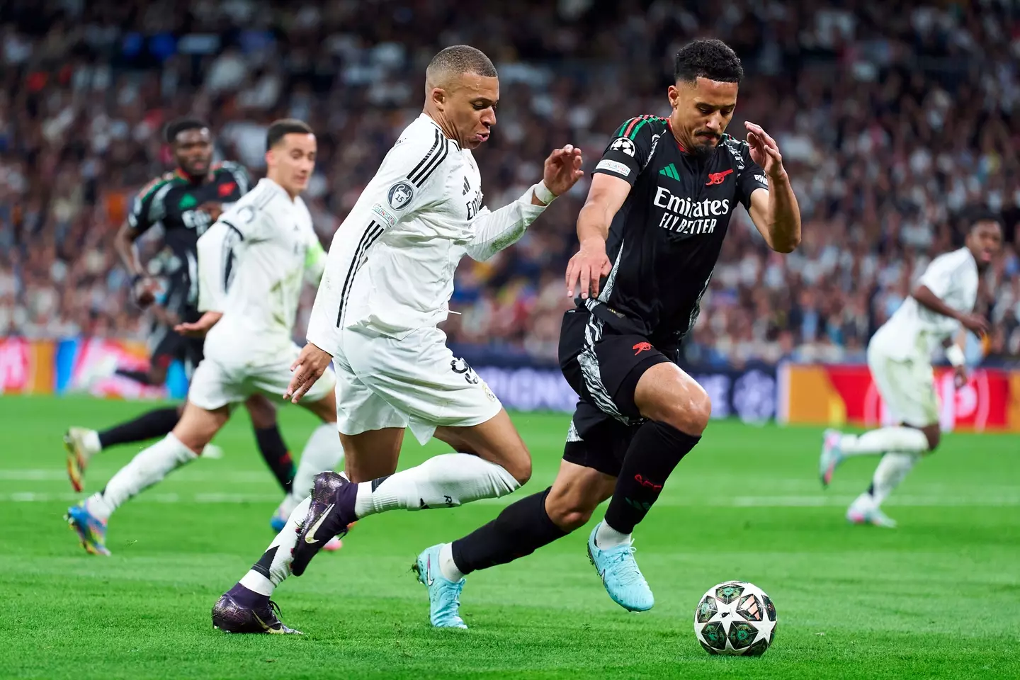 William Saliba jostles with Real Madrid's Kylian Mbappe at the Bernabeu. Image: Getty