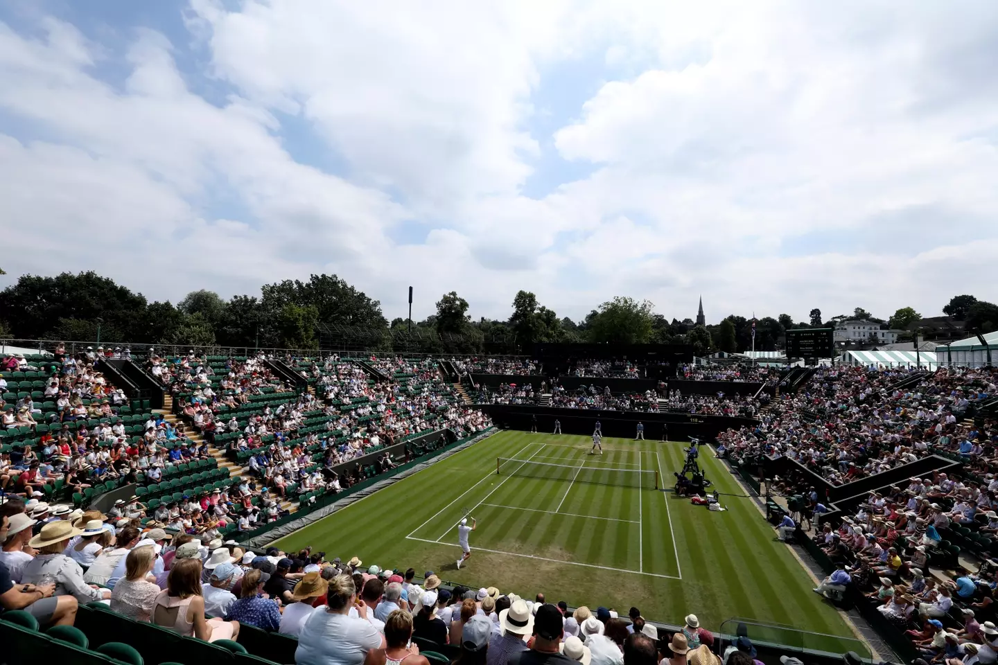 John Millman and Milos Raonic at Wimbledon.