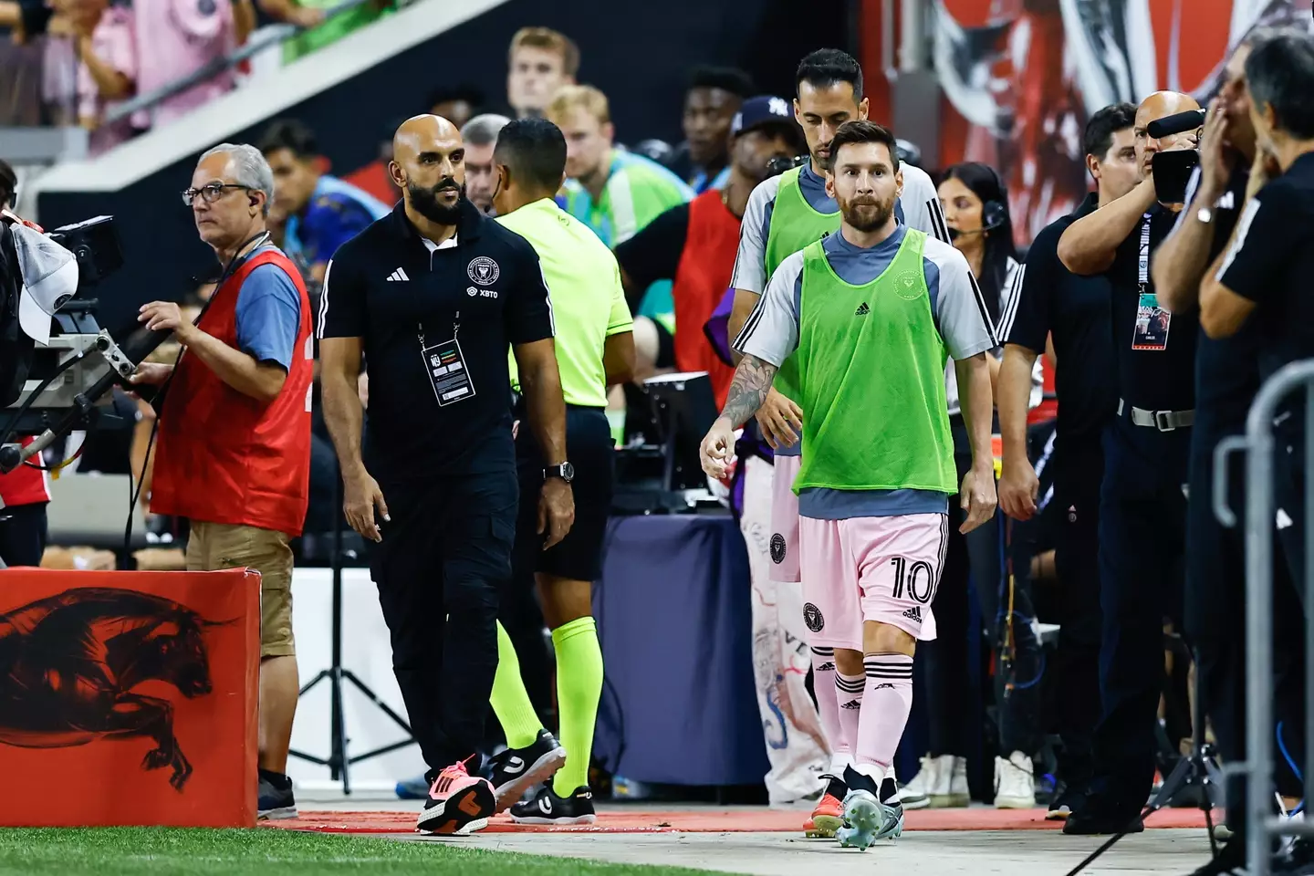 Messi alongside Chueko at an Inter Miami game. (Image