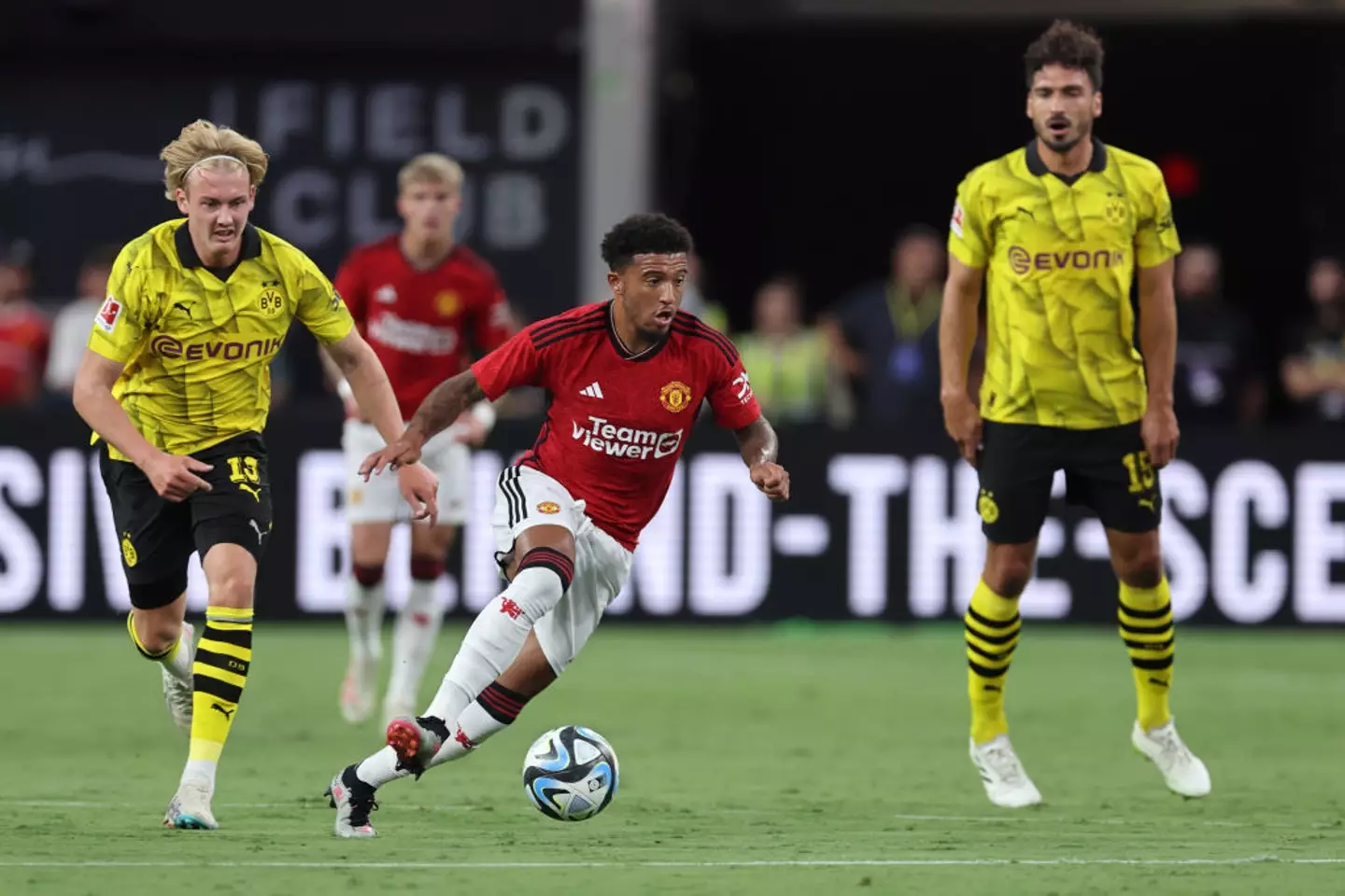 Sancho playing against Dortmund for Manchester United- Getty
