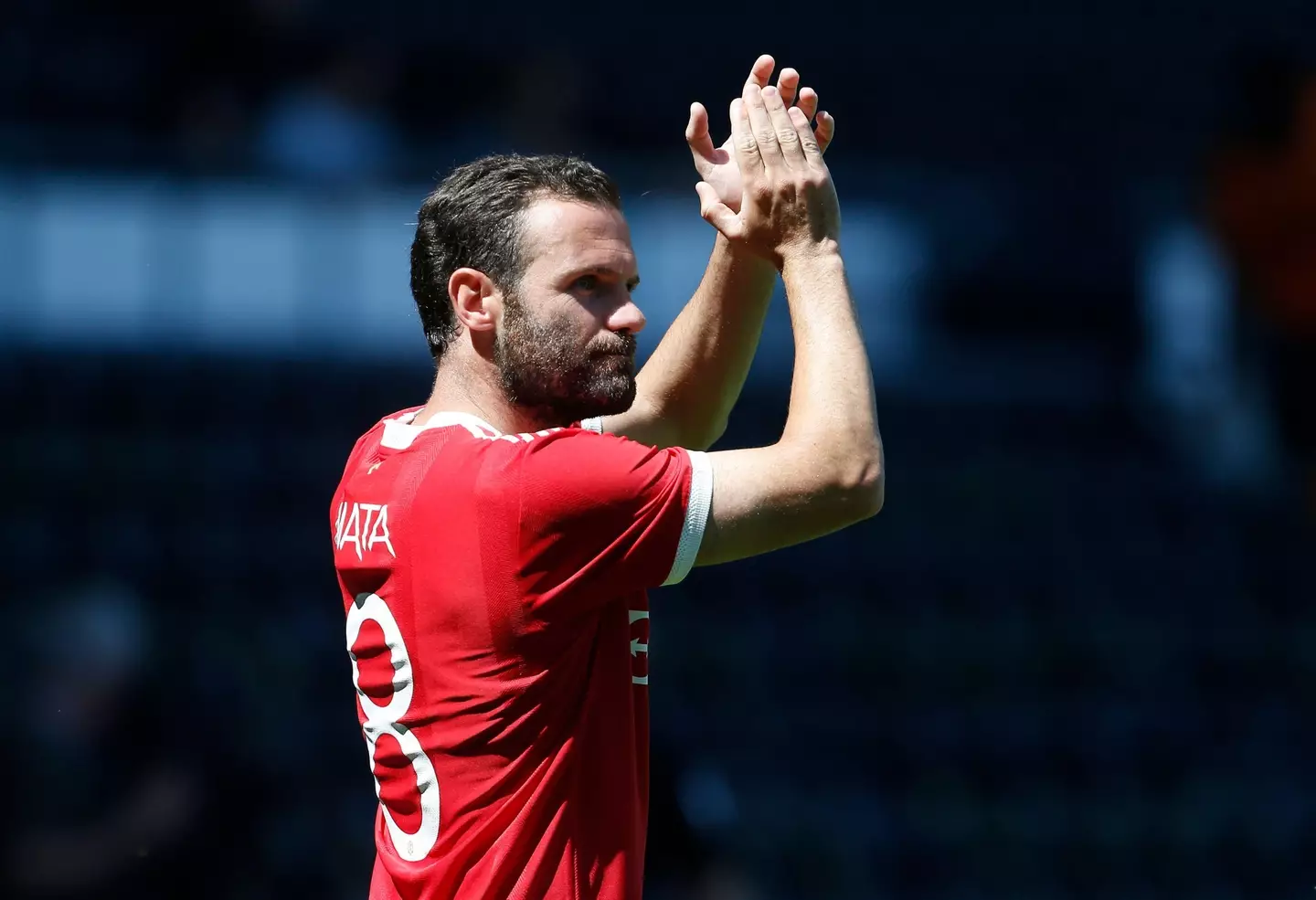Juan Mata clapping travelling Manchester United supporters |
