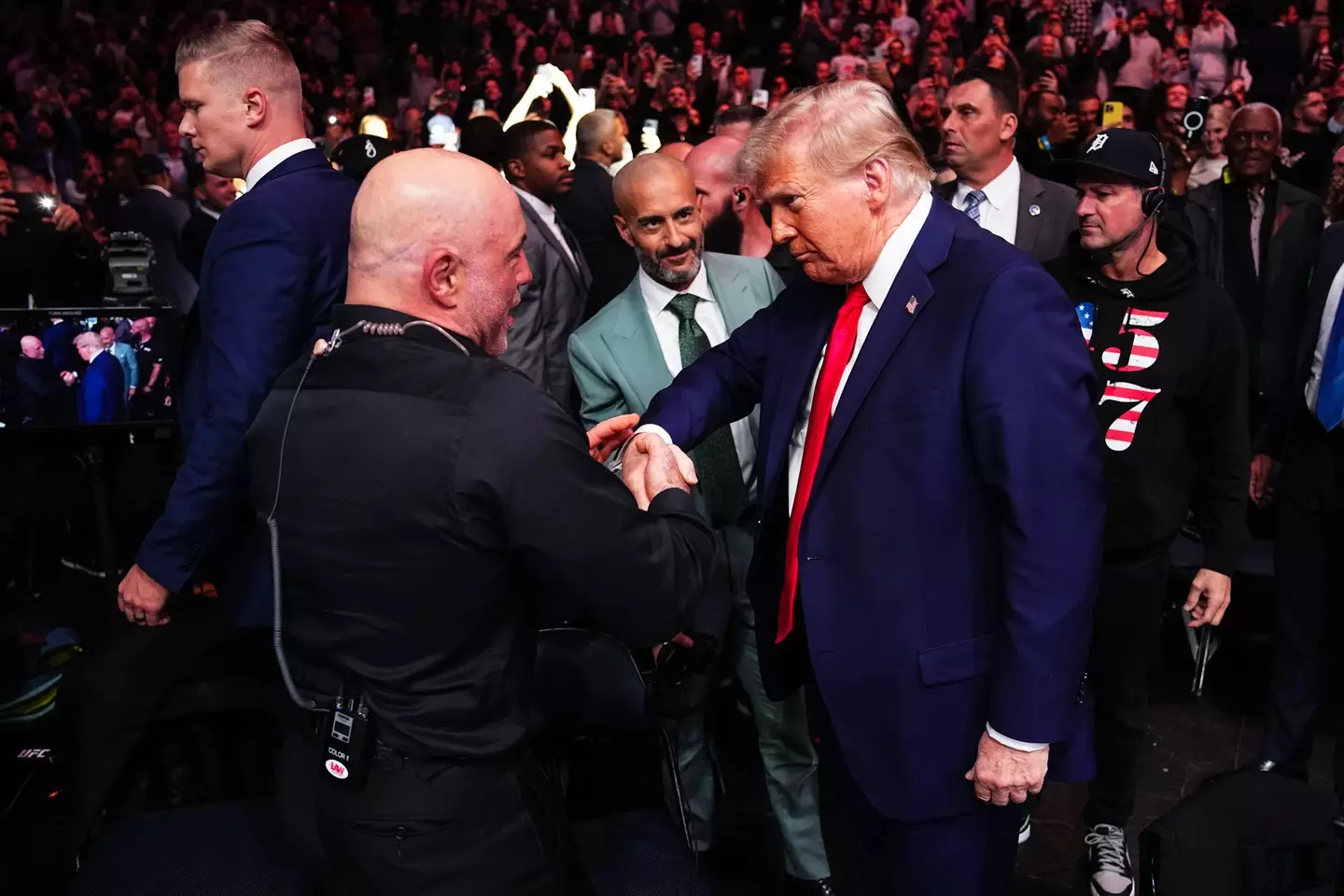 Joe Rogan and Donald Trump share a warm embrace at UFC 309. Image: Getty