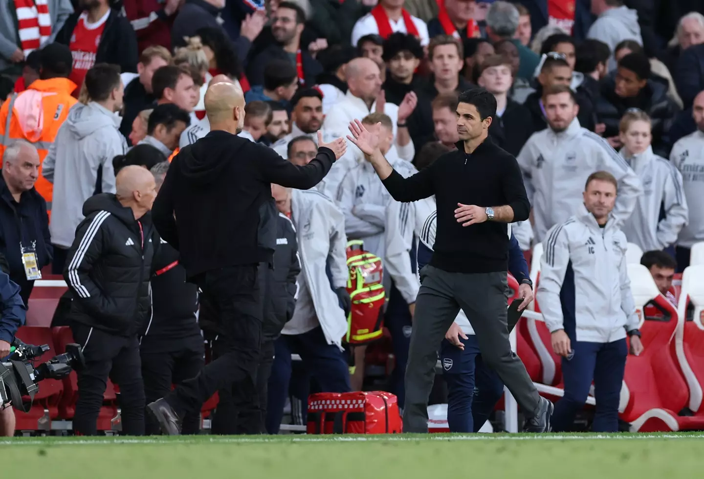 Guardiola and Arteta shake hands after Sunday's game. Image credit: Getty