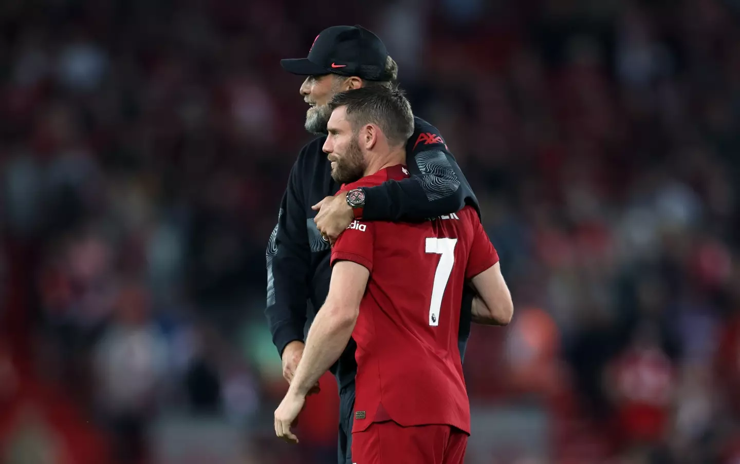 Jurgen Klopp and James Milner embrace after a Liverpool match. Image: Getty 