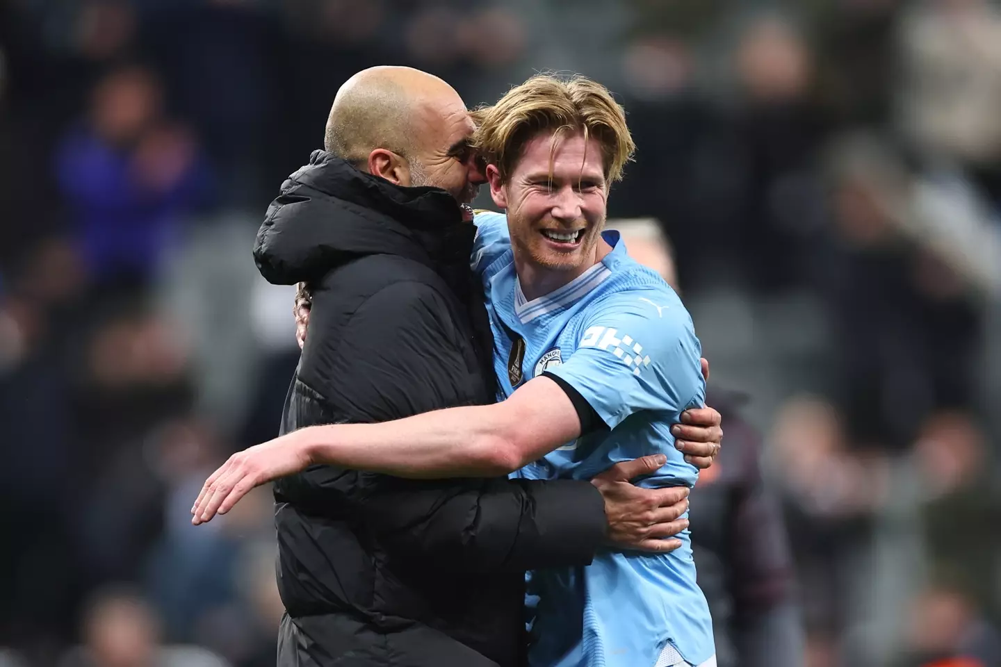 Kevin De Bruyne celebrates with Pep Guardiola after the final whistle. Image: Getty
