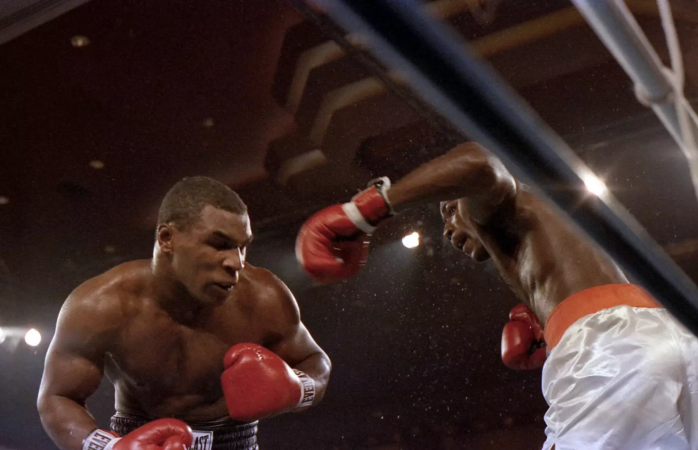 Mike Tyson (L) moves against Jose Ribalta during a bout at Trump Plaza Hotel on August 17, 1986 in Atlantic City, New Jersey. Image credit: Getty