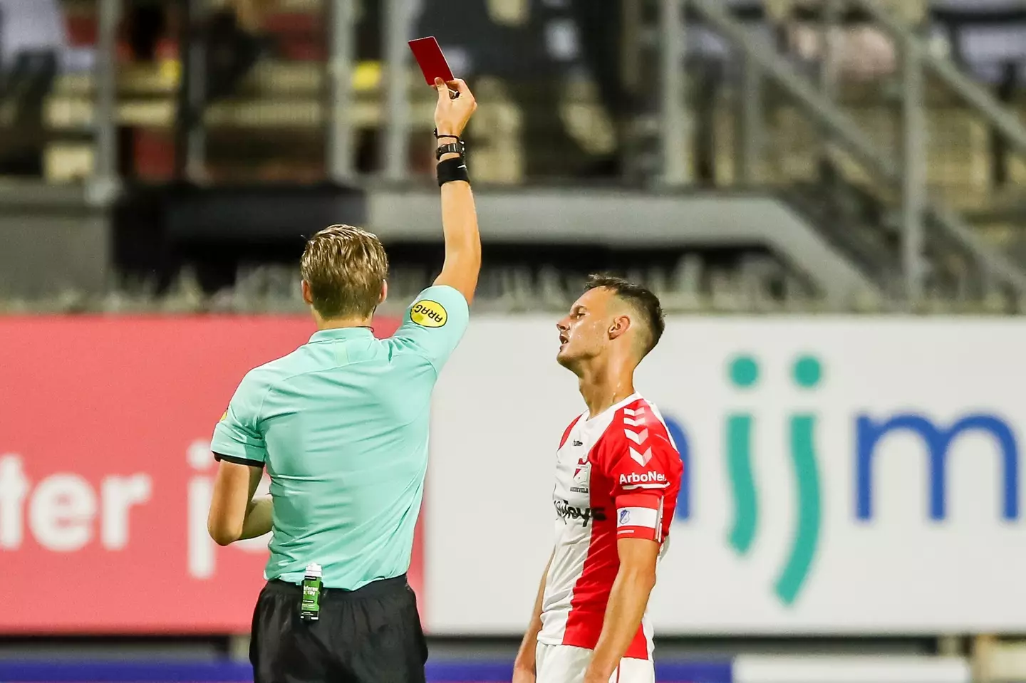 Jeff Hardeveld given the red card by referee Sander van der Eijk during the Dutch Keukenkampioendivisie match between FC Emmen and FC Eindhoven. Image credit: Alamy