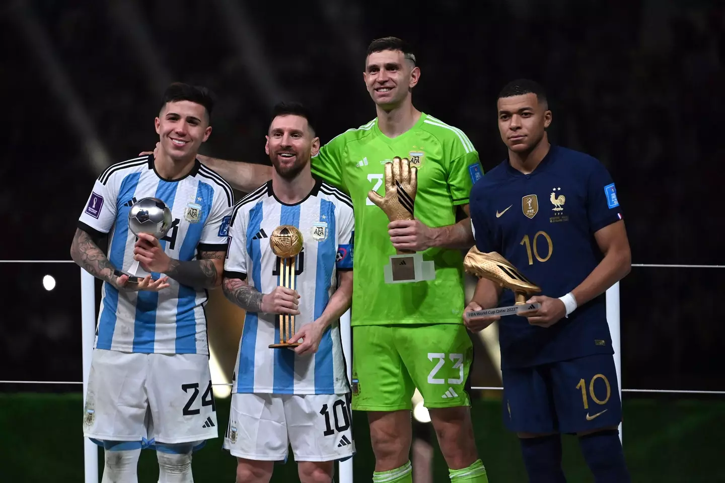 Emiliano Martinez lines up alongside Kylian Mbappe during the awards presentation. Image: Alamy 