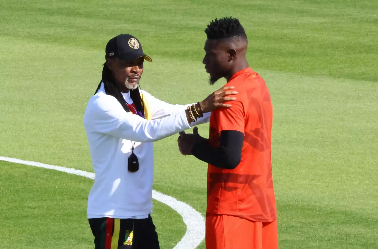 Cameroon's Andre Onana and coach Rigobert Song during the World Cup. Image credit: Alamy