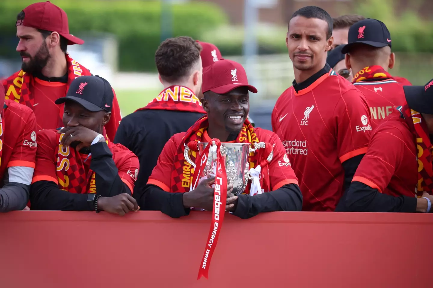 Liverpool's Sadio Mane holding the Carabao Cup trophy with Naby Keita and Joel Matip during the bus parade.