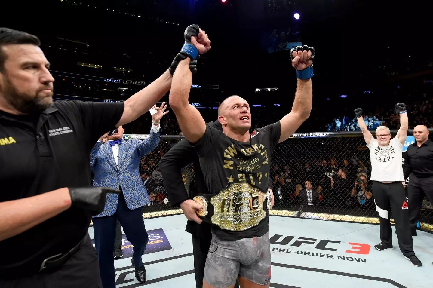 Georges St-Pierre celebrates his victory over Michael Bisping. Image: Getty