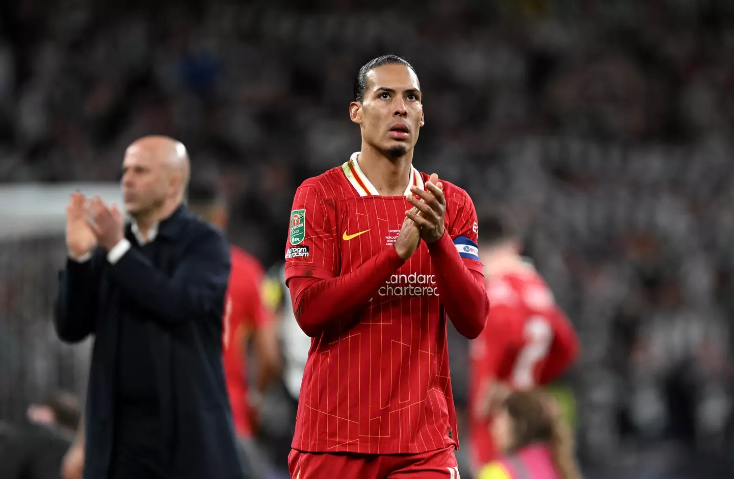 Van Dijk acknowledges the fans after Liverpool's Carabao Cup final defeat to Newcastle. Image credit: Getty