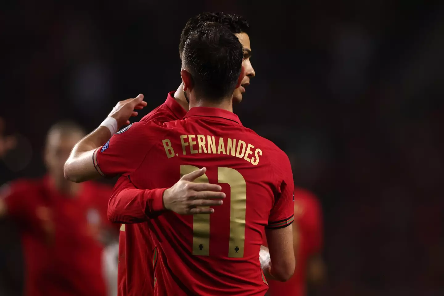 Ronaldo and Fernandes embrace during a World Cup qualifying fixture |