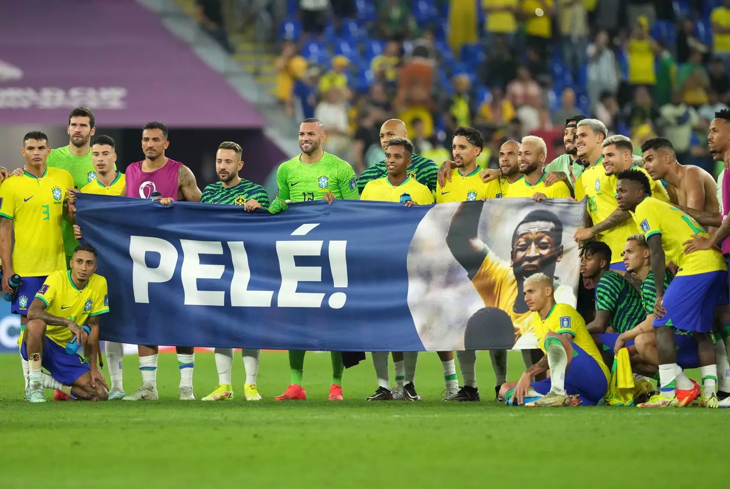 Brazil players hold up a Pele banner following their win over South Korea. Image: Alamy 