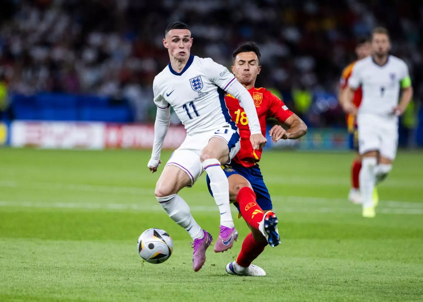 Spain's Martin Zubimendi battles for the ball with Phil Foden during the Euro 2024 final -