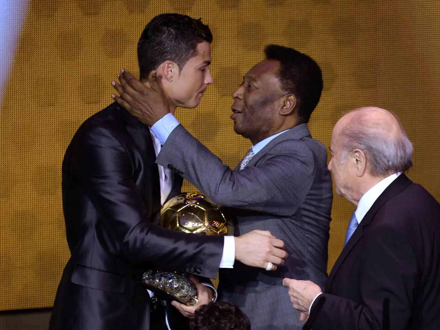 Cristiano Ronaldo and Pele embrace during the Ballon d'Or ceremony in 2014. Image: Alamy